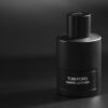 Elegant black Tom Ford Ombre Leather perfume bottle in studio lighting.