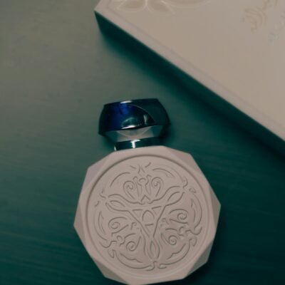 Sophisticated perfume bottle with intricate design, exuding elegance and luxury.