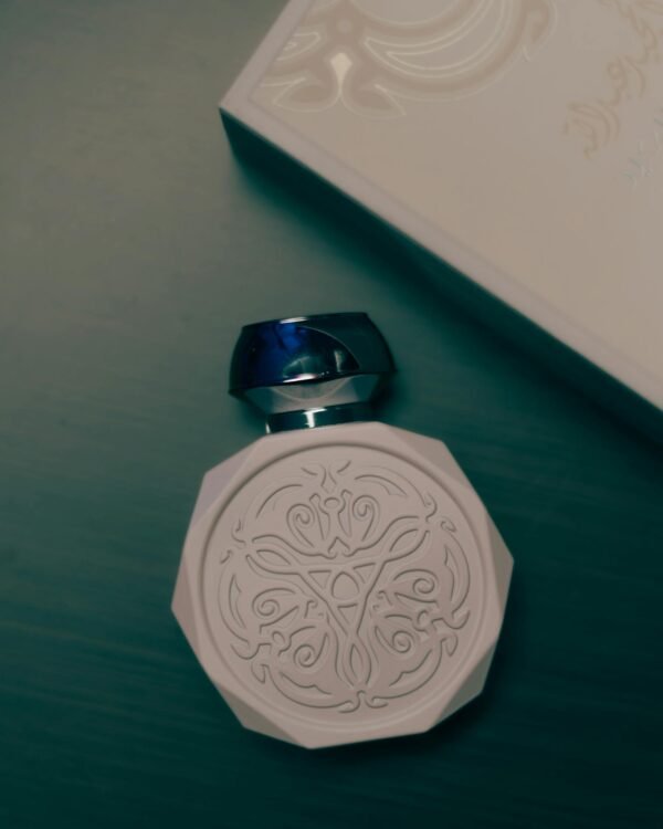 Sophisticated perfume bottle with intricate design, exuding elegance and luxury.